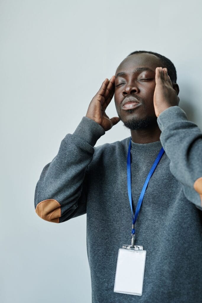 Tired professional concentrating and looking stressed, reflecting the hidden effort of adult ADHD