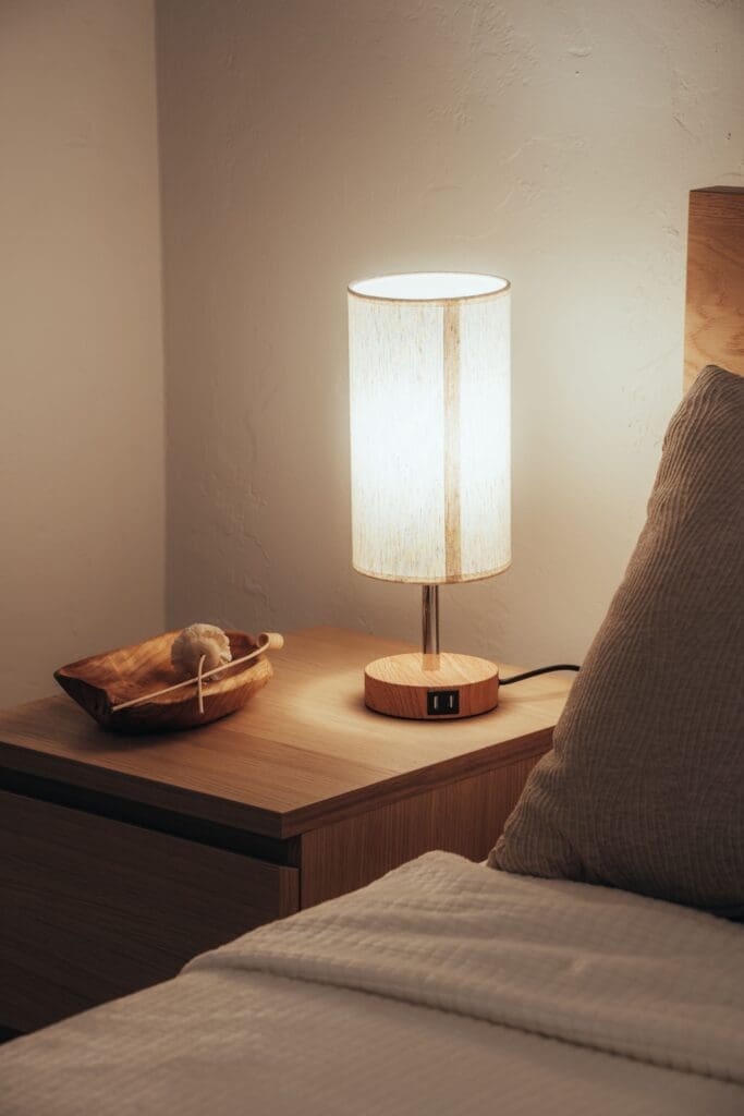 Bedside lamp on in the early hours, illustrating late-night rumination and overthinking