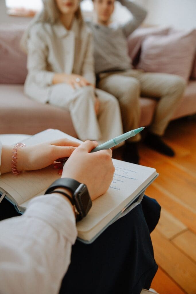 Couples therapist speaking with two clients in an Ottawa counselling office